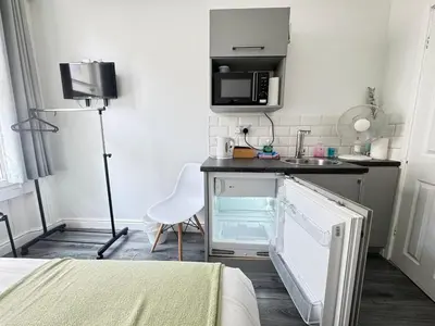 a small kitchen with a sink and a microwave at Bold Street Studio II in Liverpool
