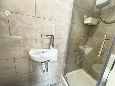 a bathroom with a sink and a shower at Bold Street Studio II in Liverpool