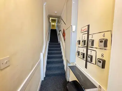 a long hallway with stairs in a building at Bold Street Studio II in Liverpool