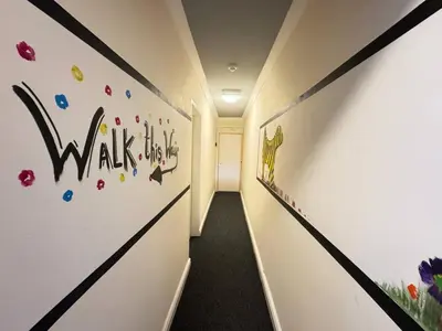 a hallway with a wall with the words walk at Bold Street Studio II in Liverpool