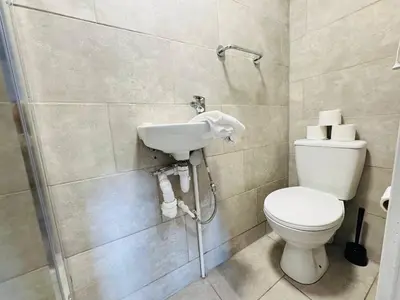 a bathroom with a toilet and a sink at Bold Street Studio VI in Liverpool