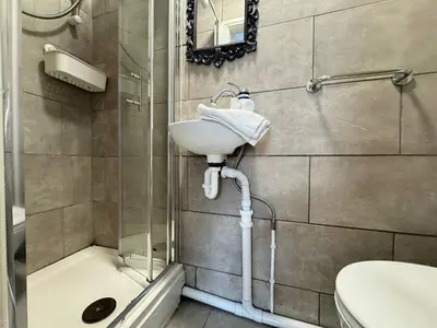 a bathroom with a sink and a shower at Bold Street Studio VII in Liverpool