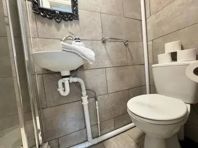 a bathroom with a sink and a toilet at Bold Street Studio VII in Liverpool