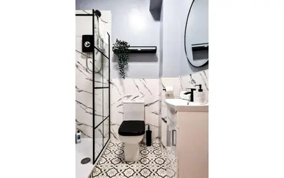 a bathroom with a toilet and a sink at Lodginet Stays - County Cosy - 1BR Flat 2 in Liverpool