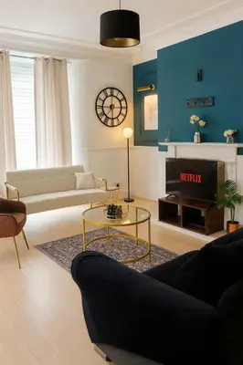 a living room with a couch and a table at Cosy Two-Bedroom House in Ormskirk in Pemberton