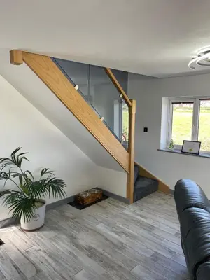 a living room with a staircase in a house at Ulverstons little gem - Sleeps 2 - Free Parking in Ulverston