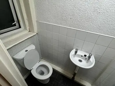 a bathroom with a toilet and a sink at Reads Avenue 1 Bed Apartment - Next To H&A Social Club - Minutes from Winter Gardens & Town Centre! in Blackpool