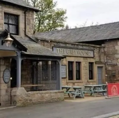 a building with a picnic table in front of it at 2-Bedroom Flat Near River Lune in Halton