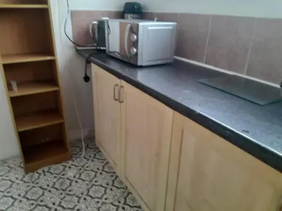 a microwave sitting on top of a counter in a kitchen at Modern Seaside Stay at Bela Grove-Sleeps8 in Blackpool