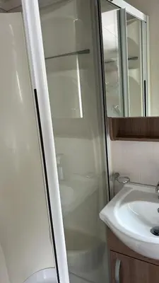 a bathroom with a shower and a sink at Heysham Coastal Escape Family 3-Bed Caravan in Heysham
