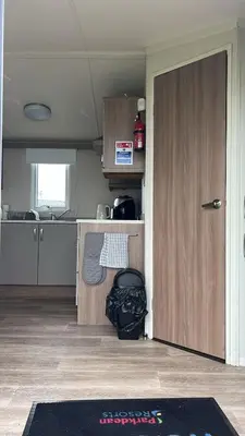 an open door in a room with a kitchen at Heysham Coastal Escape Family 3-Bed Caravan in Heysham