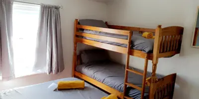 two bunk beds in a room with a window at Bel Reve Hotel in Blackpool