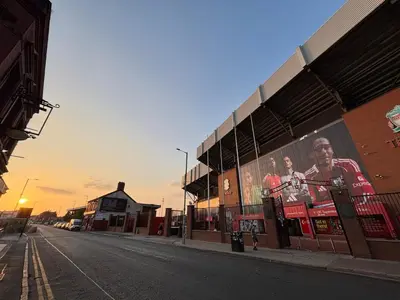 an empty street with a billboard on the side of a building at Liverpool Escape - 5 min walk to LFC Stadium, Sleeps 8, free parking, newly renovated home in Liverpool