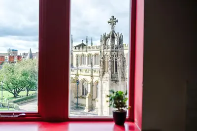 a view of a church from a window at Modern 2BR near Wigan Town Centre in Wigan