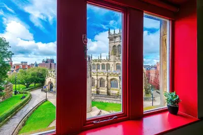 an open window with a view of a building at Modern 2BR near Wigan Town Centre in Wigan