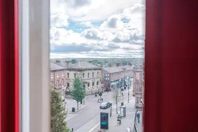 a view of a city street from a window at Modern 2BR near Wigan Town Centre in Wigan