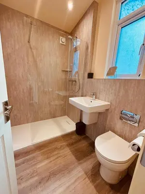 a bathroom with a toilet and a sink and a shower at 8 Parker Street in Lancaster