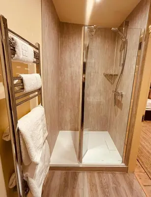 a shower with a glass door in a bathroom at 8 Parker Street in Lancaster