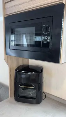 a black toaster oven with a black basket underneath it at B10 - The Escape Pod in Heysham