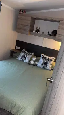a bedroom with a bed with two pillows on it at B10 - The Escape Pod in Heysham