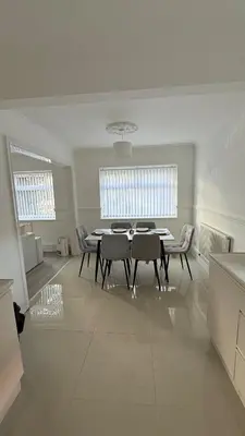 a dining room with a table and chairs at Anfield Stay Free Parking 5 minute walk in Liverpool
