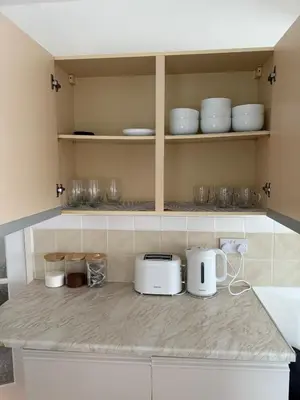 a kitchen with white appliances on a counter at Anfield Stay Free Parking 5 minute walk in Liverpool
