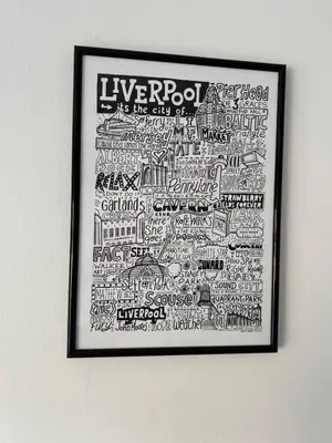 a framed picture of the city of liverpool on a wall at Anfield Stay Free Parking 5 minute walk in Liverpool