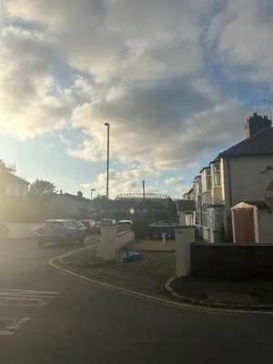 a street with cars parked in a parking lot at Anfield Stay Free Parking 5 minute walk in Liverpool
