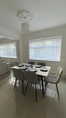 a dining room with a table and chairs at Anfield Stay Free Parking 5 minute walk in Liverpool