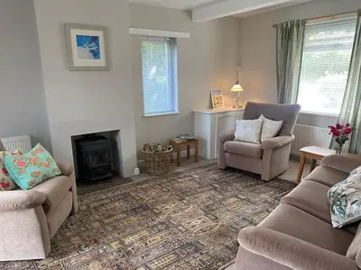 a living room with two couches and a fireplace at Yealand Redmayne 3 bed Home in Beetham