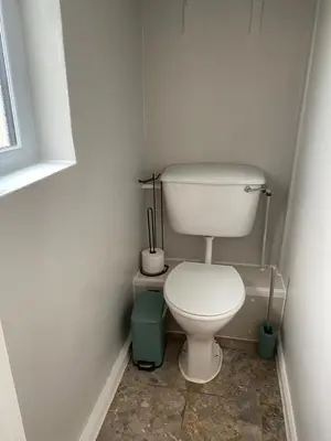 a small bathroom with a toilet and a window at Yealand Redmayne 3 bed Home in Beetham