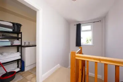 a room with a staircase and a window at 2 Bed Flat in Ulverston in Ulverston