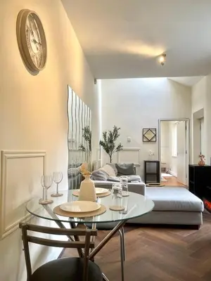 a living room with a table and a couch at Valentinez Properties - Apart Hotel with a garden in Liverpool in Liverpool