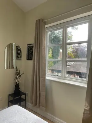 a bedroom with a window with a view at Valentinez Properties - Apart Hotel with a garden in Liverpool in Liverpool