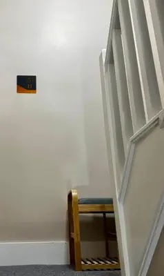 a stair case with a bench in a room at Stylish and Bright 1 Bedroom Flat in Wallasey
