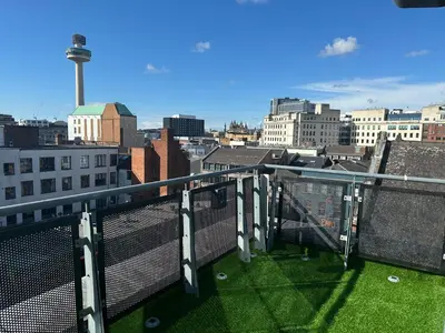 a balcony with a view of a city at City Centre Penthouse on Concert Square with City Views in Liverpool