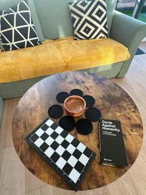 a chess board and a book on a table at City Centre Penthouse on Concert Square with City Views in Liverpool