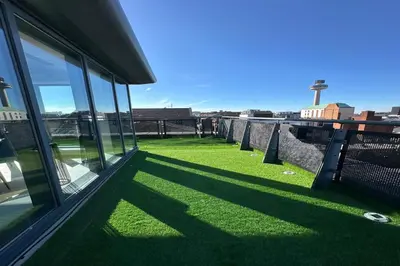 a view of the grass outside of a building at City Centre Penthouse on Concert Square with City Views in Liverpool