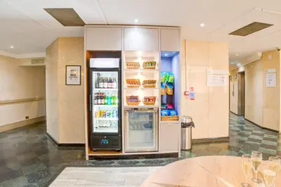a refrigerator in a building with its door open at Atlantic Tower Liverpool City Center By Dancenter in Liverpool