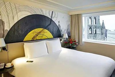 a hotel room with a large bed and a window at Atlantic Tower Liverpool City Center By Dancenter in Liverpool