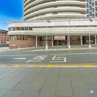 an empty street in front of a large building at Atlantic Tower Liverpool City Center By Dancenter in Liverpool