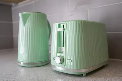 two green appliances sitting next to each other on a counter at Mersey View 4 Bedroom by Liverpoollux Next To Everton Stadium in Liverpool