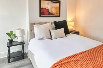 a bedroom with a large white bed with pillows at Host & Stay - Bishop House in Liverpool