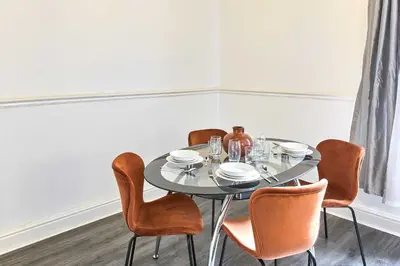 a dining room with a table and chairs at Host & Stay - Bishop House in Liverpool