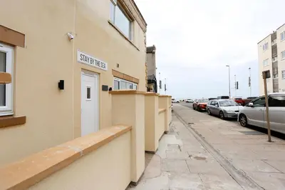 a building with a street sign on the side of it at STAY BY THE SEA Deluxe Apartment in Blackpool