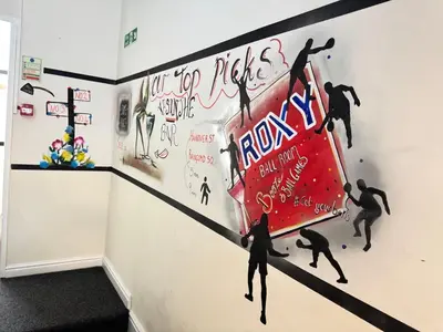 a mural of surfers on a wall in a room at Bold Street Studio III in Liverpool