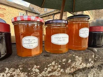 a group of three jars of honey on a table at The Snug- A beautiful and characterful property connected to a historic Georgian Manor House in Overton