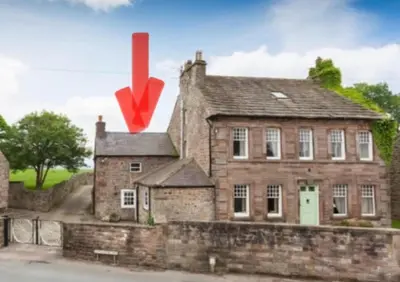 an old brick house with a red x on it at The Snug- A beautiful and characterful property connected to a historic Georgian Manor House in Overton