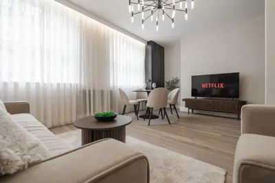 a living room with a couch and a tv and a table at Sunnie stays apartment harrington chambers in Liverpool