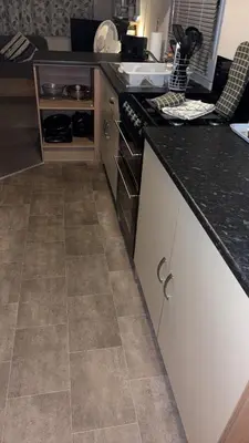 a kitchen with a stove and a counter top at Bills place in Heysham